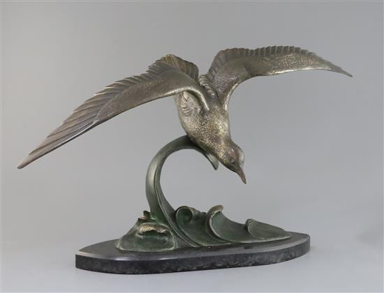 Irene Rochard. An Art Deco bronze model of a seagull flying above waves, height 15in.
